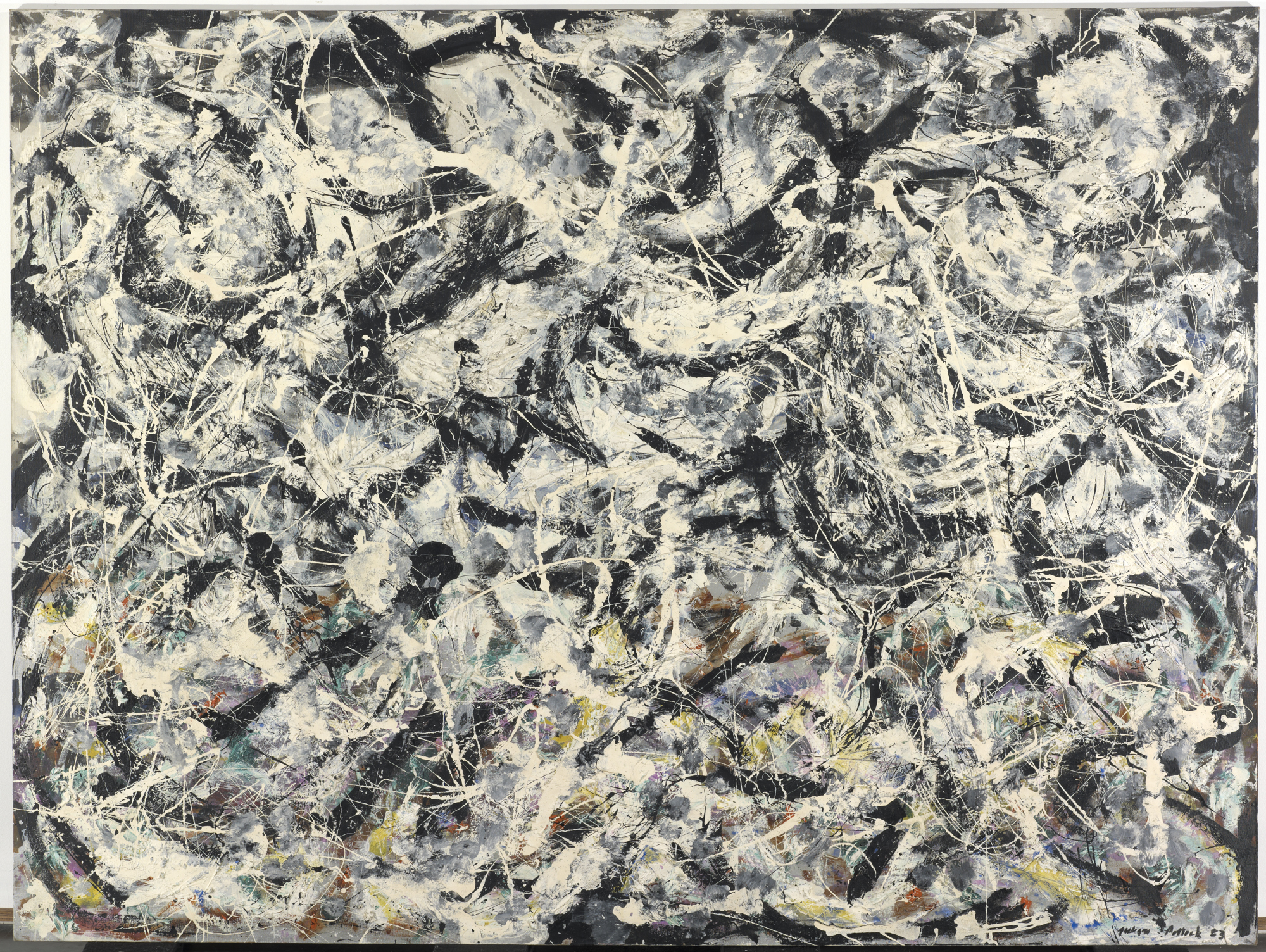 Abstract painting, black background covered with flicks and smudges of white and other colors.